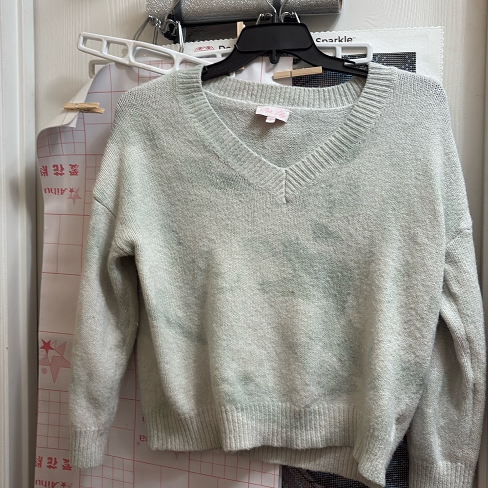 This sweater is in good condition and has no stains nor any rips or holes.